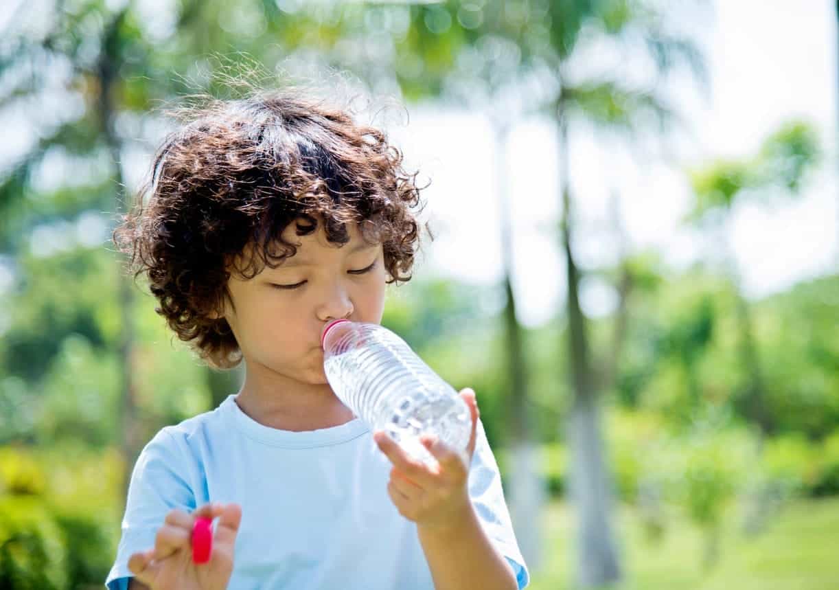 Little Boy Staying Hydrated During Summer | Burt's Pharmacy and Compounding Lab
