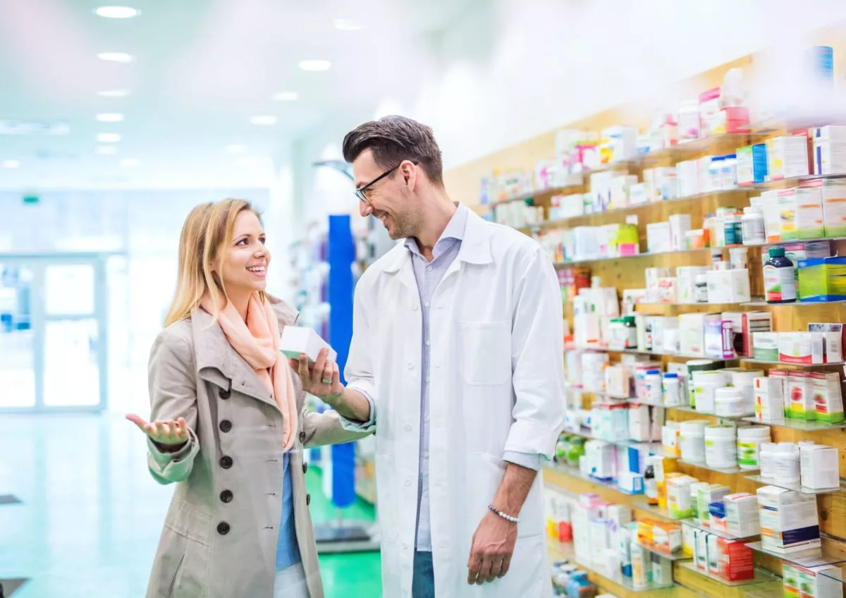 Pharmacist Helping Customer Understand Her Potential Common Drug Interactions | Burt's Pharmacy and Compounding Lab