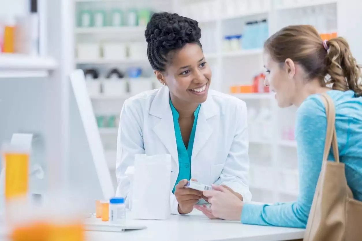 Explaining a Prescription at the Pharmacy to a Customer - Burt's Pharmacy and Compounding Lab