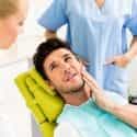 Man at Dentist with Tooth Pain - Burt's Pharmacy and Compounding Lab